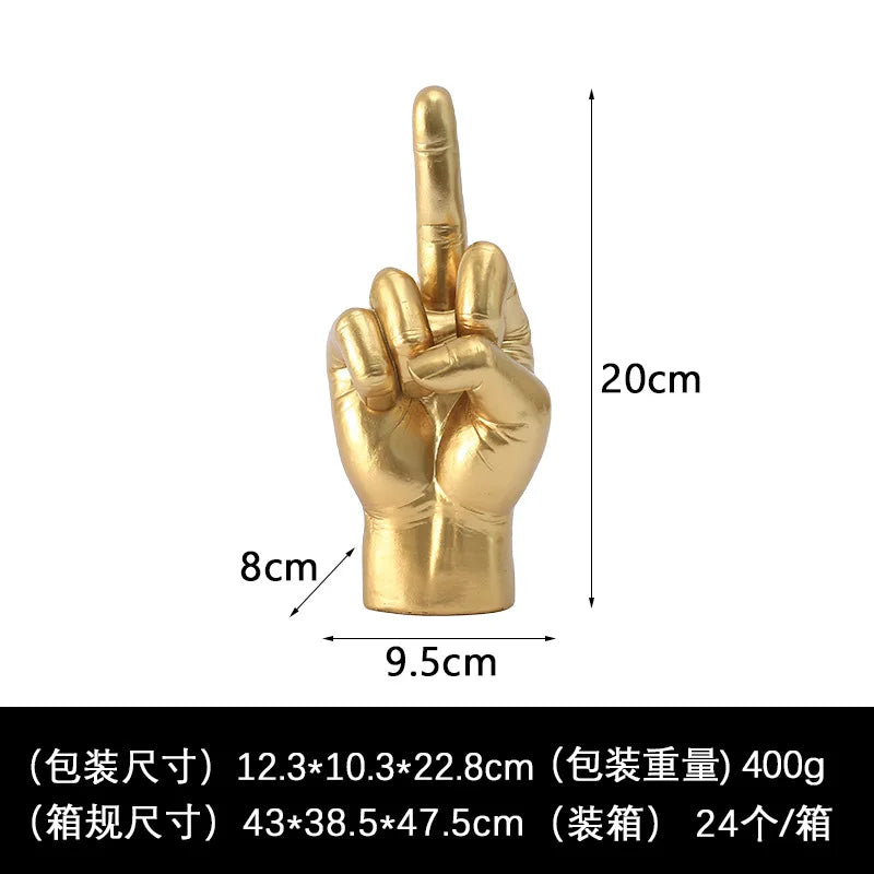 Gold-coloured, realistic hand sculpture showing a middle finger gesture. Decorative 20cm tall ornament.