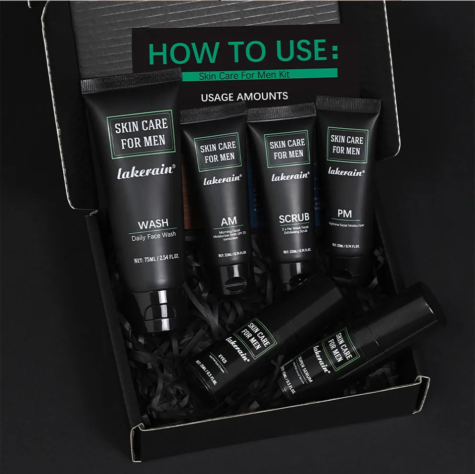 Men's skincare set in a black box containing face wash, scrub, moisturisers, eye cream, and serum in sleek black tubes.