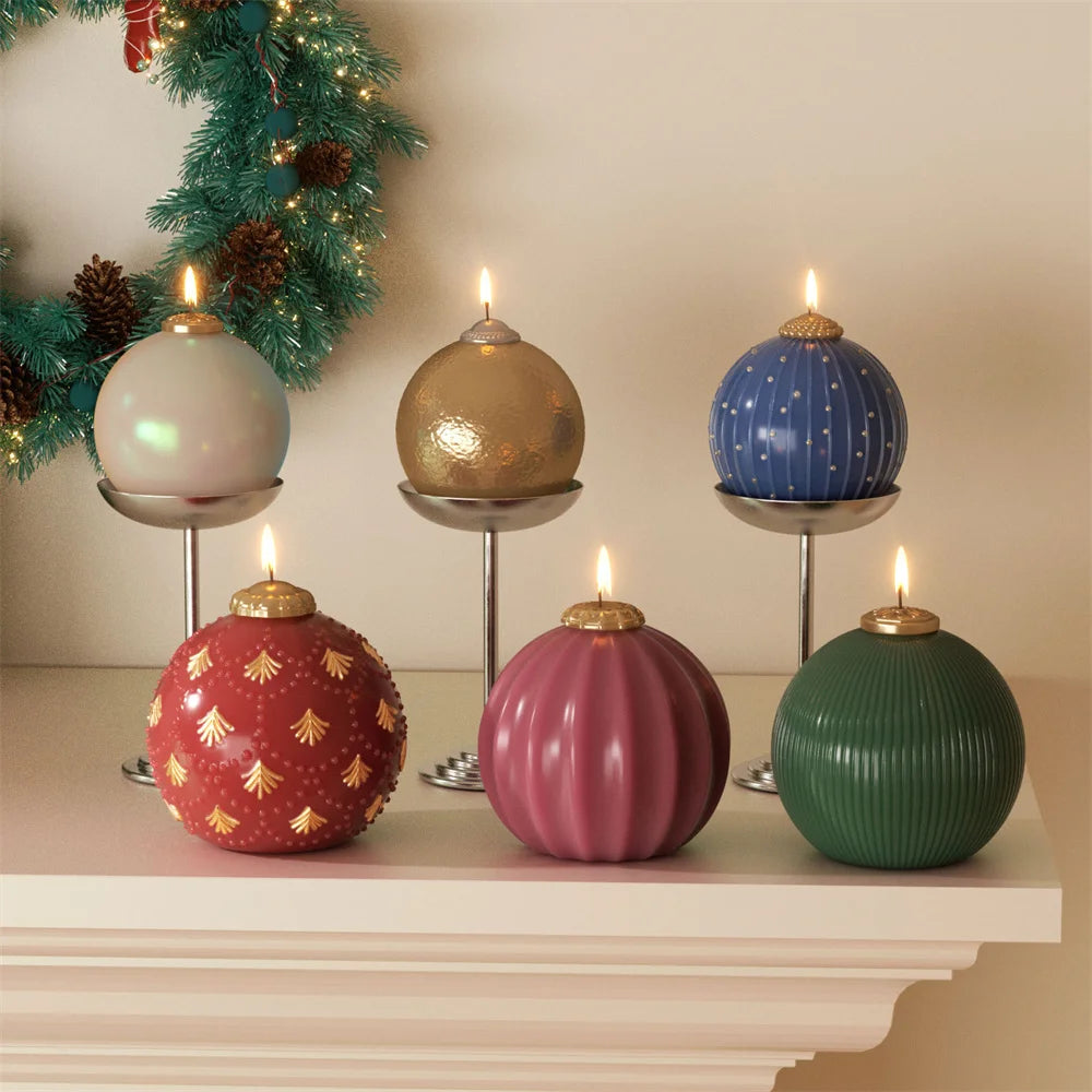 Six spherical Christmas bauble candles in white, gold, blue, red, pink, and green, burning on a mantle.