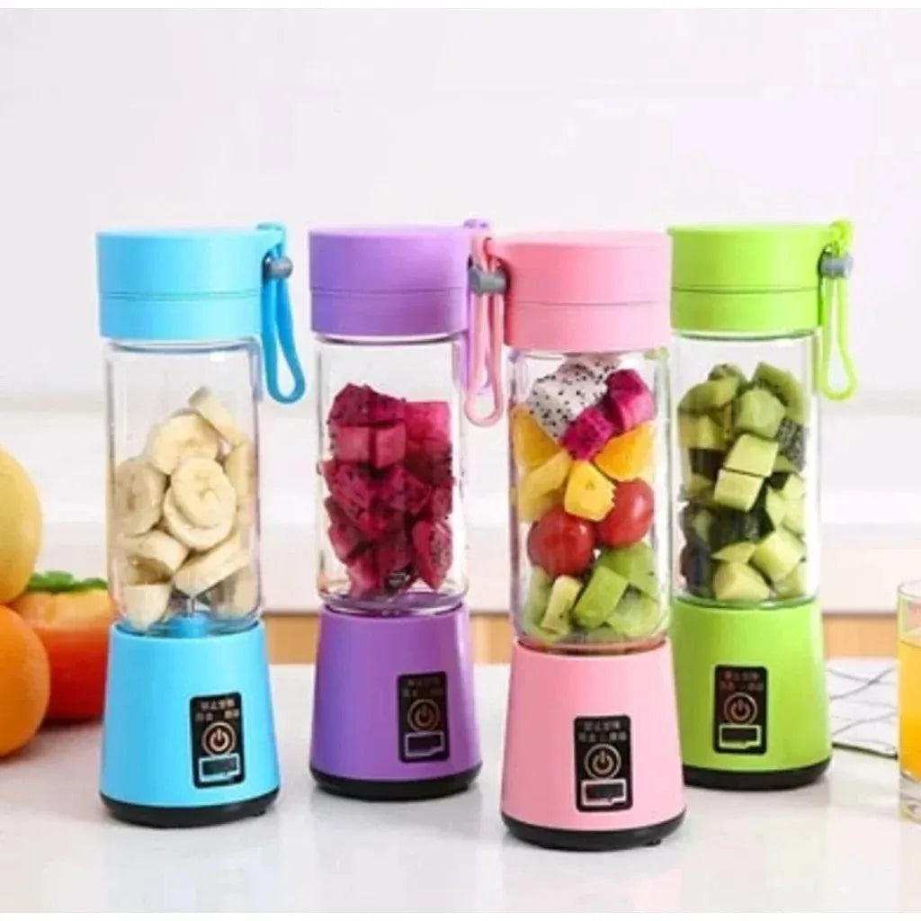 Four portable, USB-rechargeable electric blenders in blue, purple, pink, and green, each filled with chopped fruit.