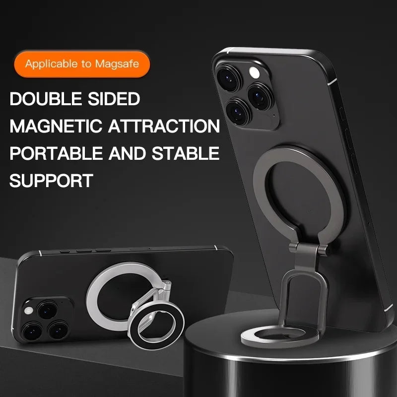 Black magnetic phone ring holder with a sleek, foldable design attached to the back of a black smartphone.
