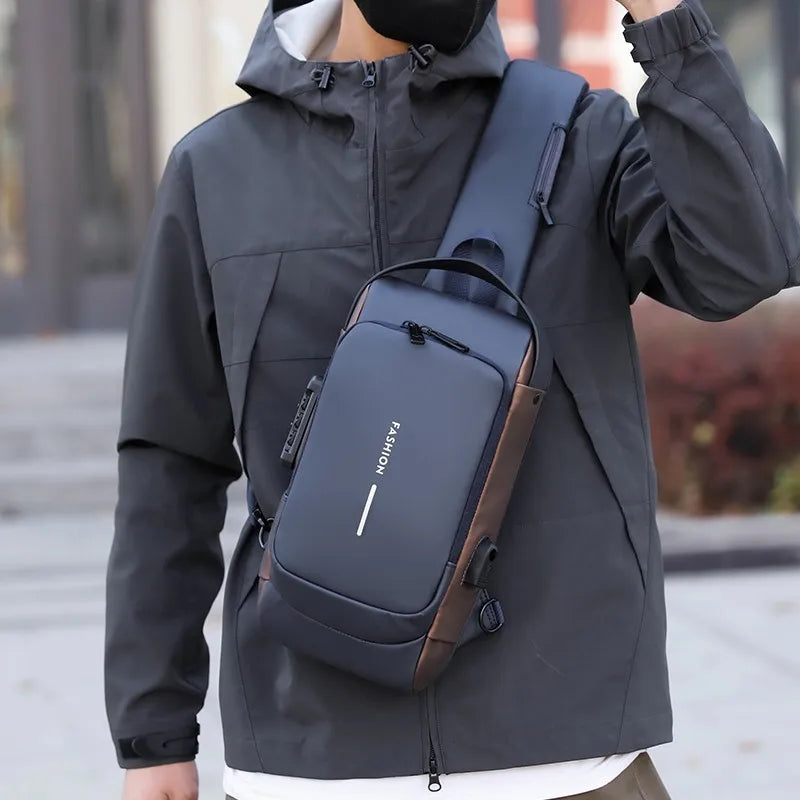 A sleek dark grey anti-theft chest bag with a combination lock and side USB charging port.