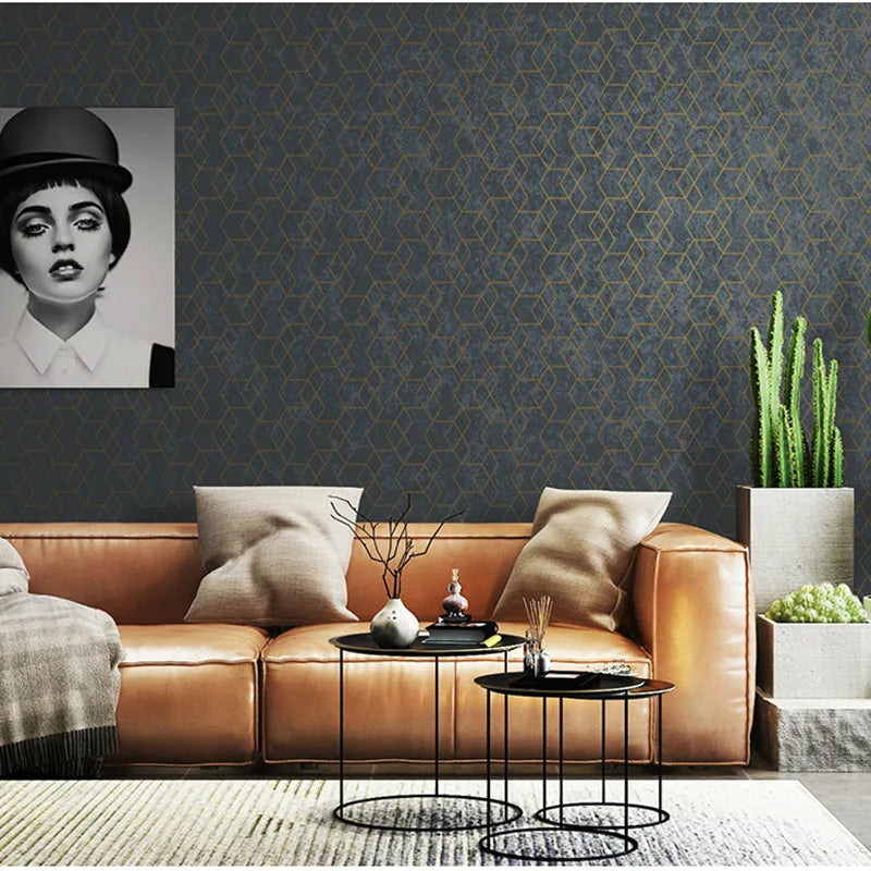 Modern dark grey wallpaper with a textured finish and thin, metallic gold geometric diamond pattern.