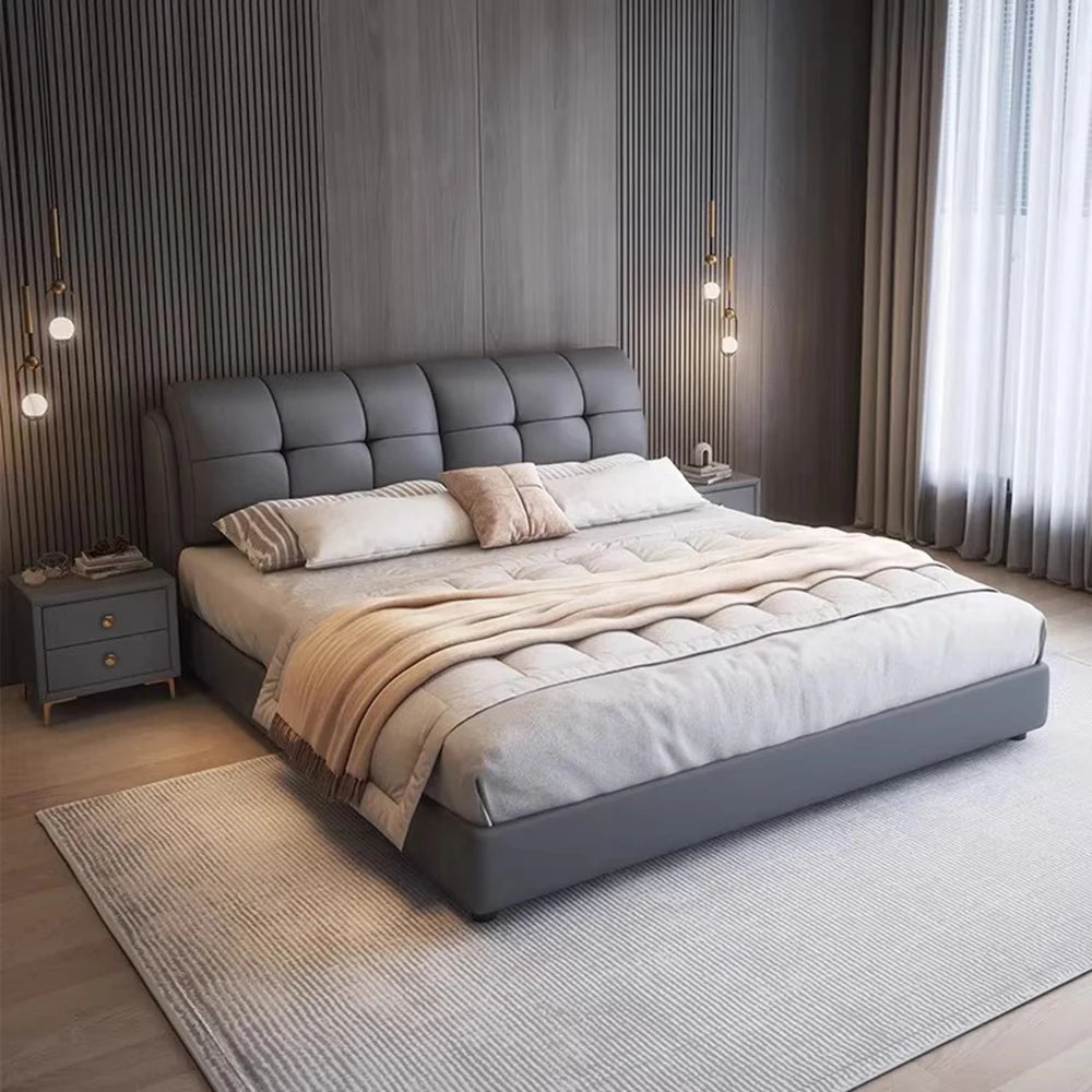 Minimalist queen bed frame in grey, featuring a tufted, cushioned headboard and a low-profile upholstered base.