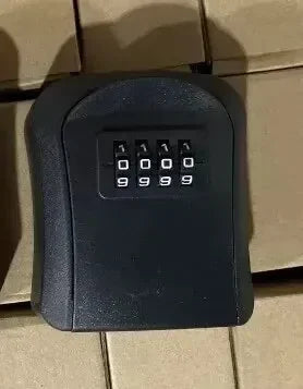 Black wall-mounted metal key lock box with a four-digit combination dial.