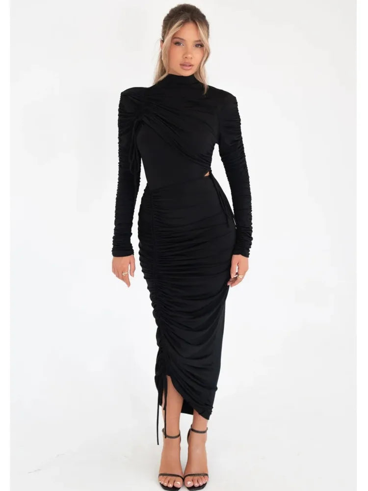 Black long-sleeved midi dress featuring a mock neck and all-over ruched detailing with asymmetric side slits.