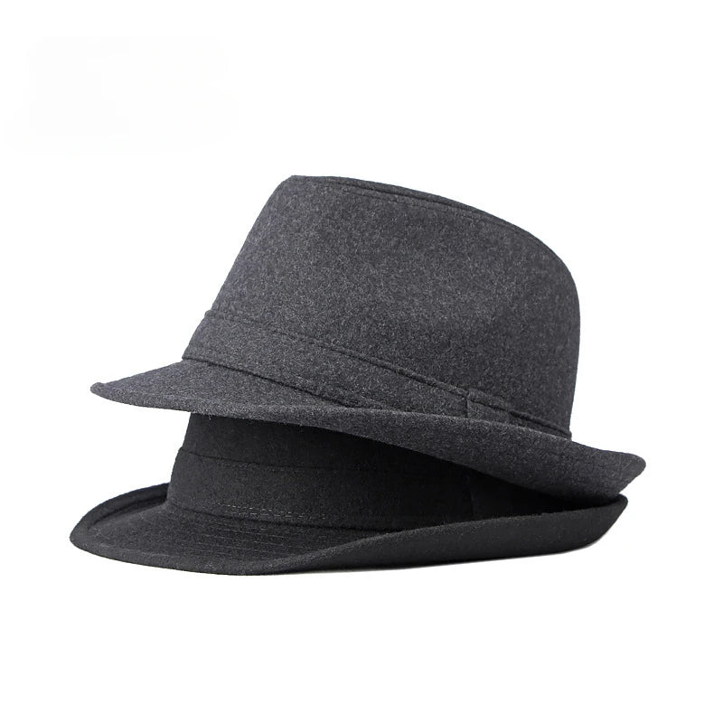 Two classic charcoal grey felt fedora hats stacked against a white background, featuring a pinched crown and short brim.