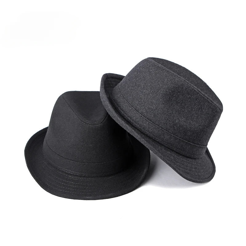 Two charcoal grey felt fedora hats with a classic jazz style, featuring short brims and structured crowns.