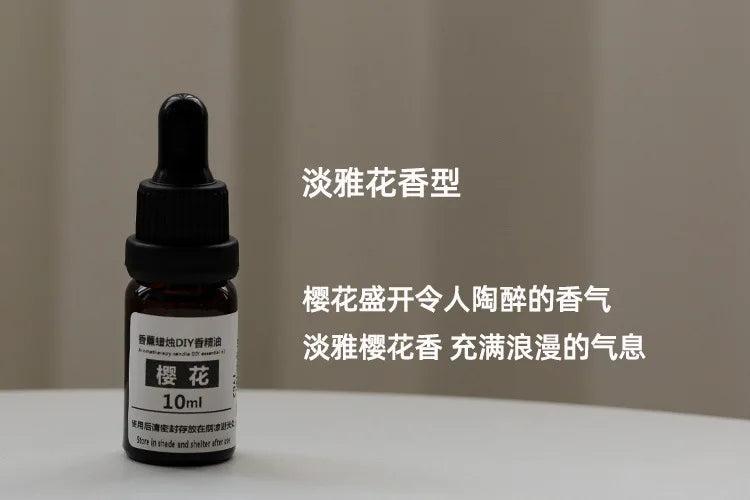 10ml amber glass essential oil bottle with a black dropper cap, labelled for cherry blossom aromatherapy scent.