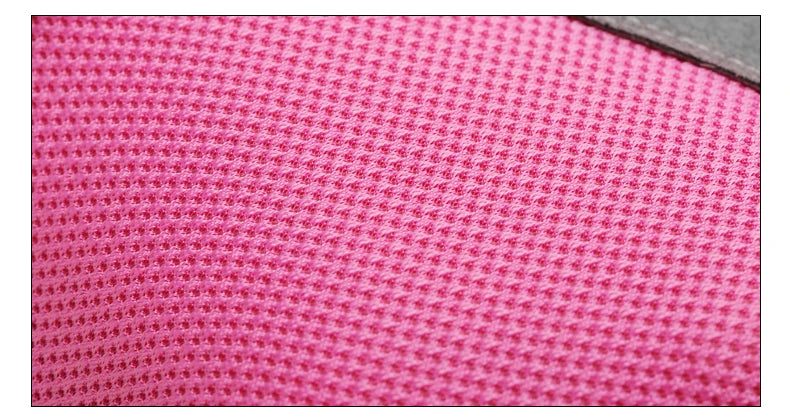 Close-up of bright pink, breathable mesh fabric texture with a small dark grey trim edge.
