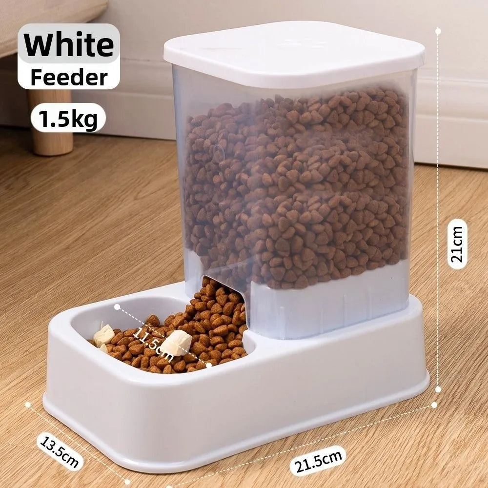 White automatic pet food dispenser with a clear 1.5kg capacity container and a wide feeding bowl base.