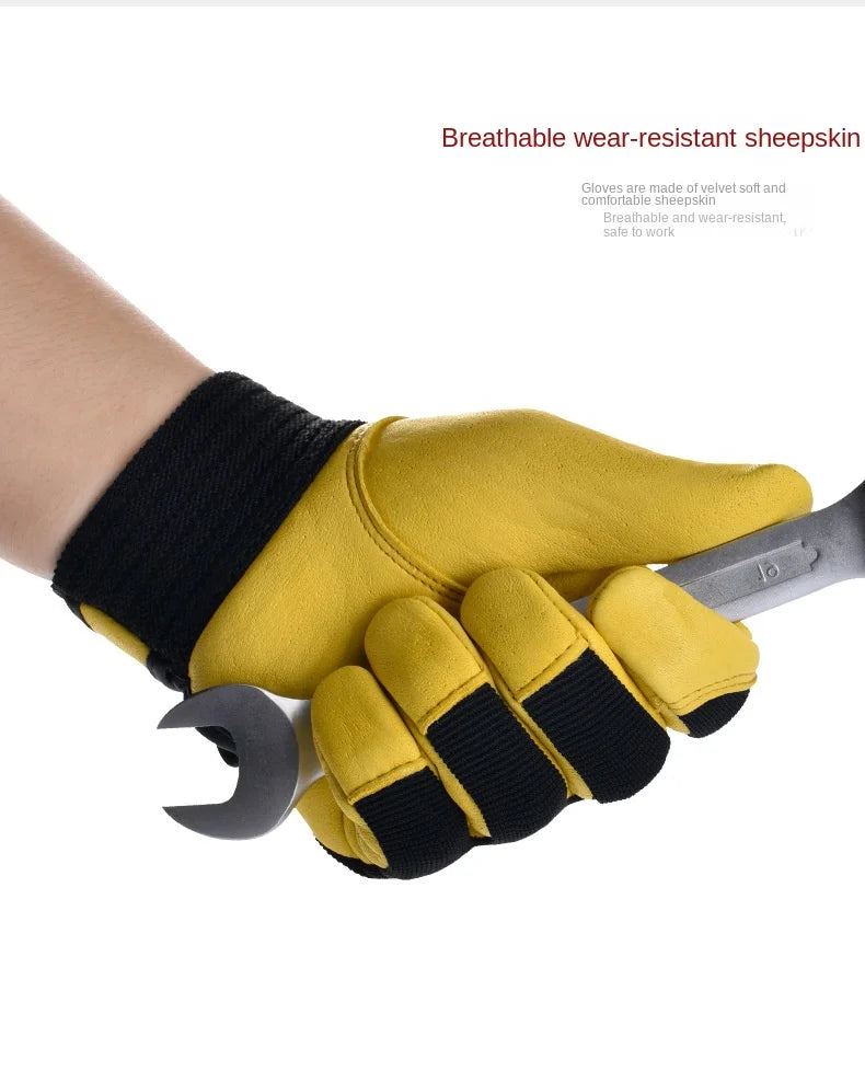 Yellow and black leather safety gloves featuring a ribbed wrist cuff, held in a hand while gripping a metal spanner.