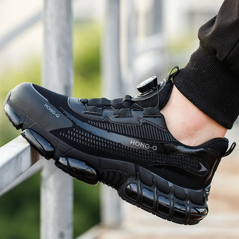 Black men’s safety work trainer with a dial lace system, steel toe cap, and shock-absorbing sole.