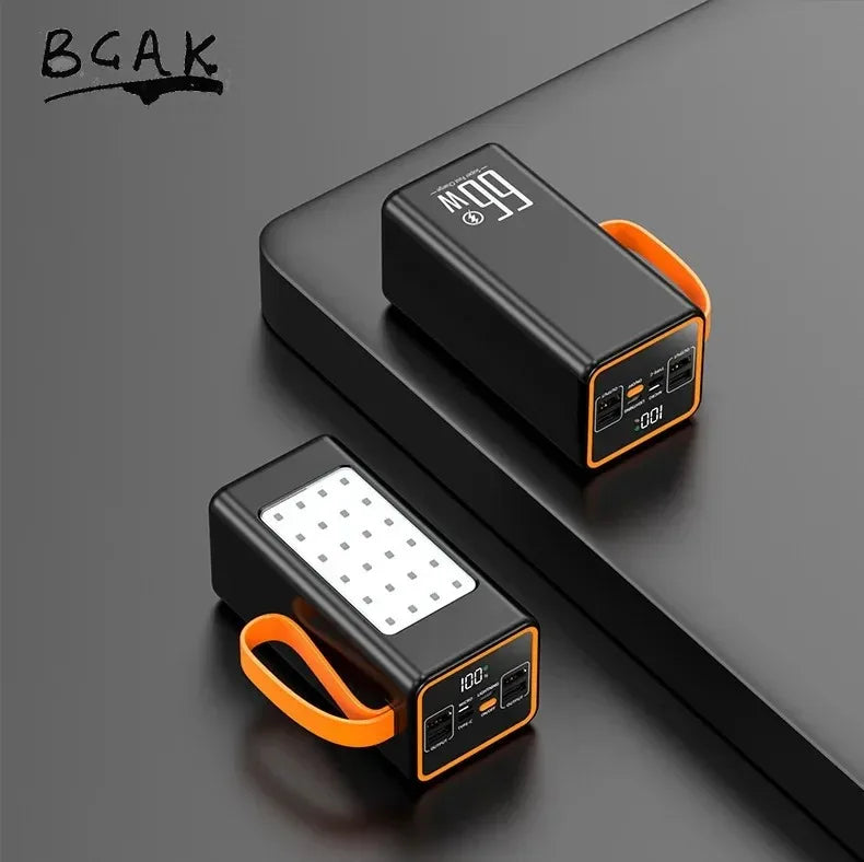 Two sleek black portable power banks with orange carry straps, LED charging displays, and a built-in light panel.