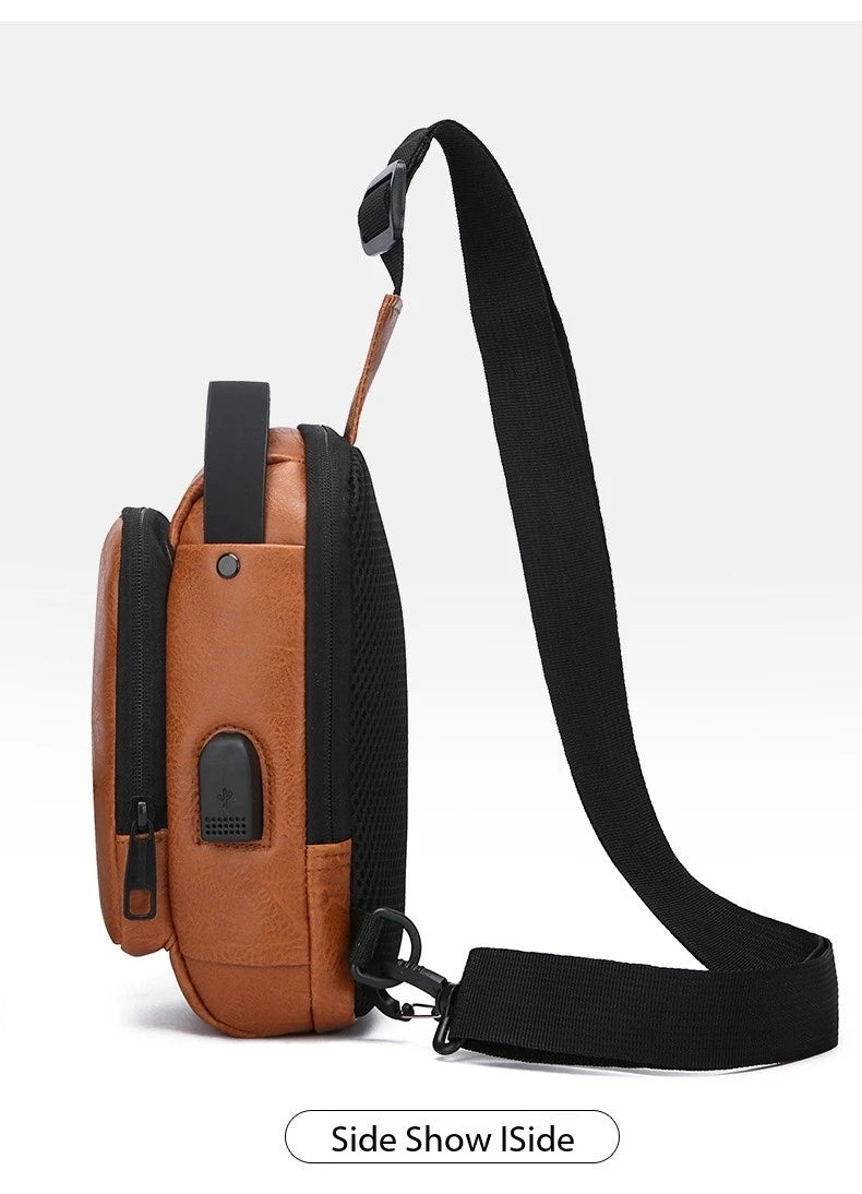 Tan faux-leather crossbody sling bag with black accents, side USB charging port, and adjustable webbing strap.