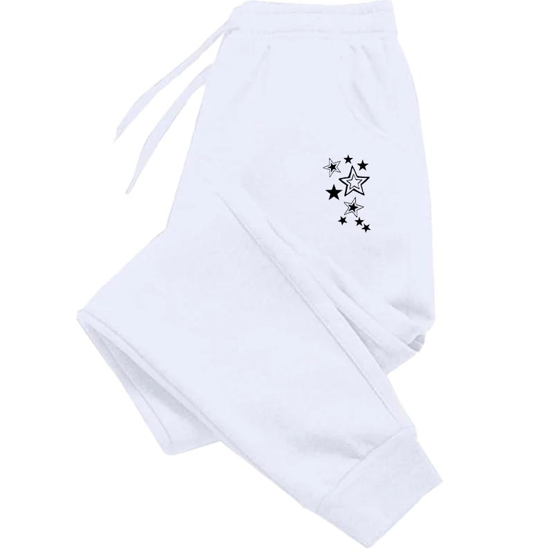 White joggers with an elasticated drawstring waist, cuffed ankles, and a black star pattern on the hip.