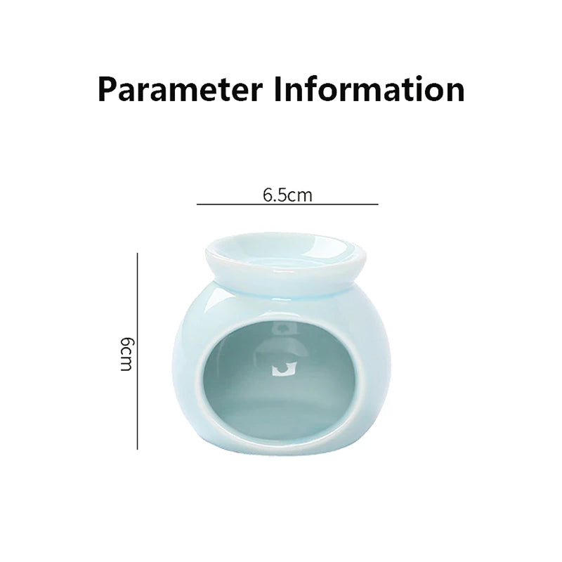 Small, pale blue ceramic wax melt burner or oil warmer, 6cm tall by 6.5cm wide with a glossy finish.