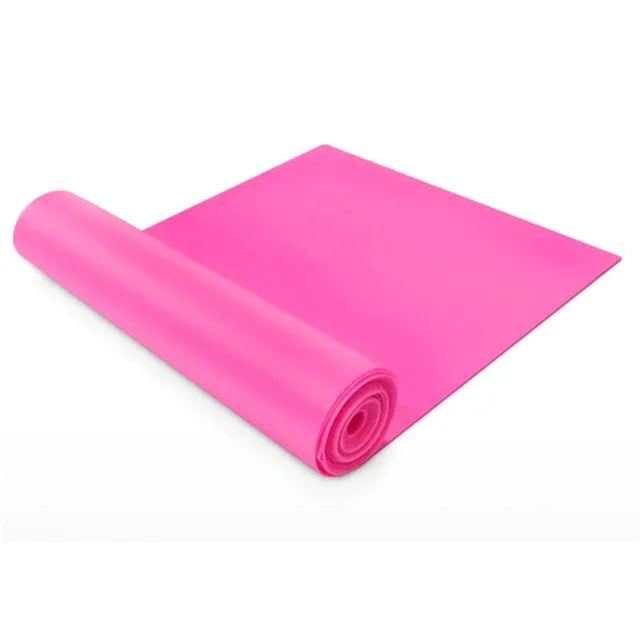 A vibrant pink yoga or exercise mat partially unrolled against a plain white background.