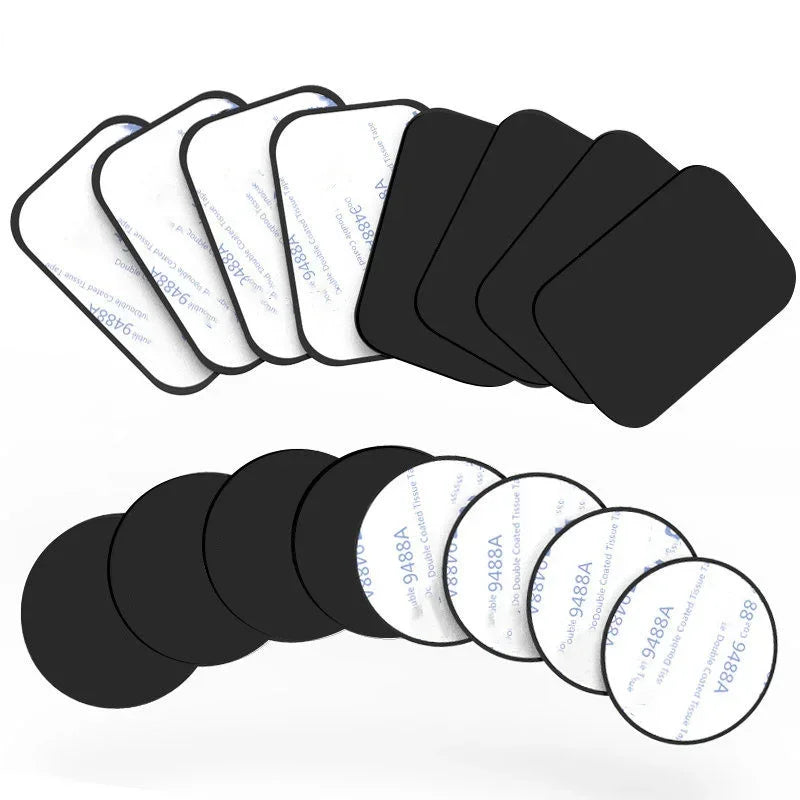 A collection of black adhesive foam pads, including rounded square and circular shapes with white protective backing.