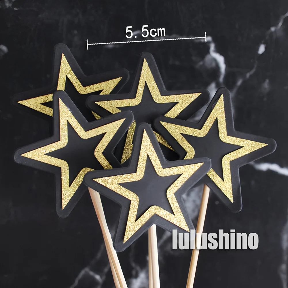 Set of 5.5cm black and gold glitter star cupcake toppers on wooden picks, perfect for celebration cakes.