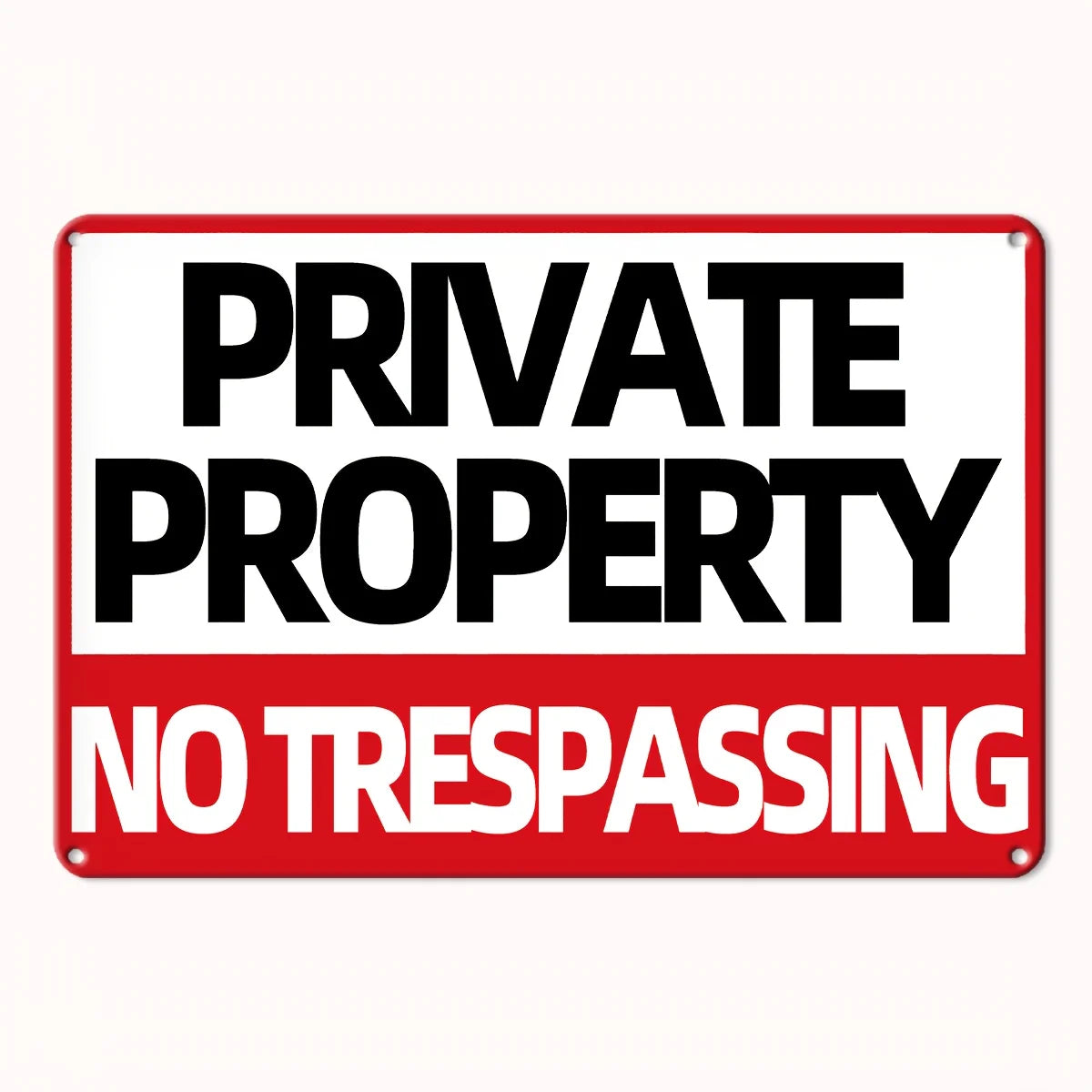 Rectangular red and white metal wall sign reading "PRIVATE PROPERTY" in black and "NO TRESPASSING" in white text.