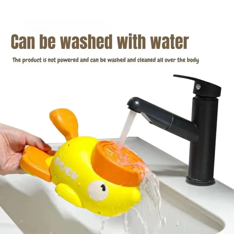 A bright yellow, duck-shaped interactive dog toy being rinsed under a tap. It is fully washable and easy to clean.