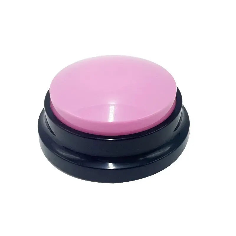 A round, recordable dog training button with a glossy pink top and a black base, set against a plain white background.