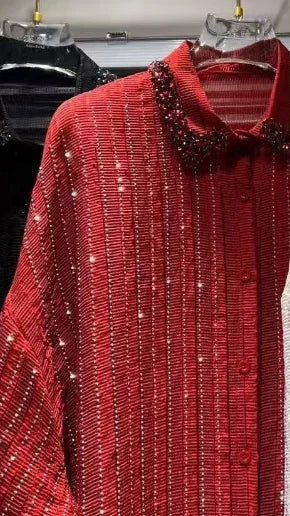 Red, pleated, long-sleeve shirt with vertical crystal stripes and a beaded collar. Button-down front, relaxed fit.