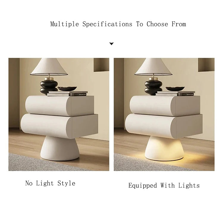 Modern white bedside table with two rounded drawers and pedestal base, shown with and without integrated base lighting.