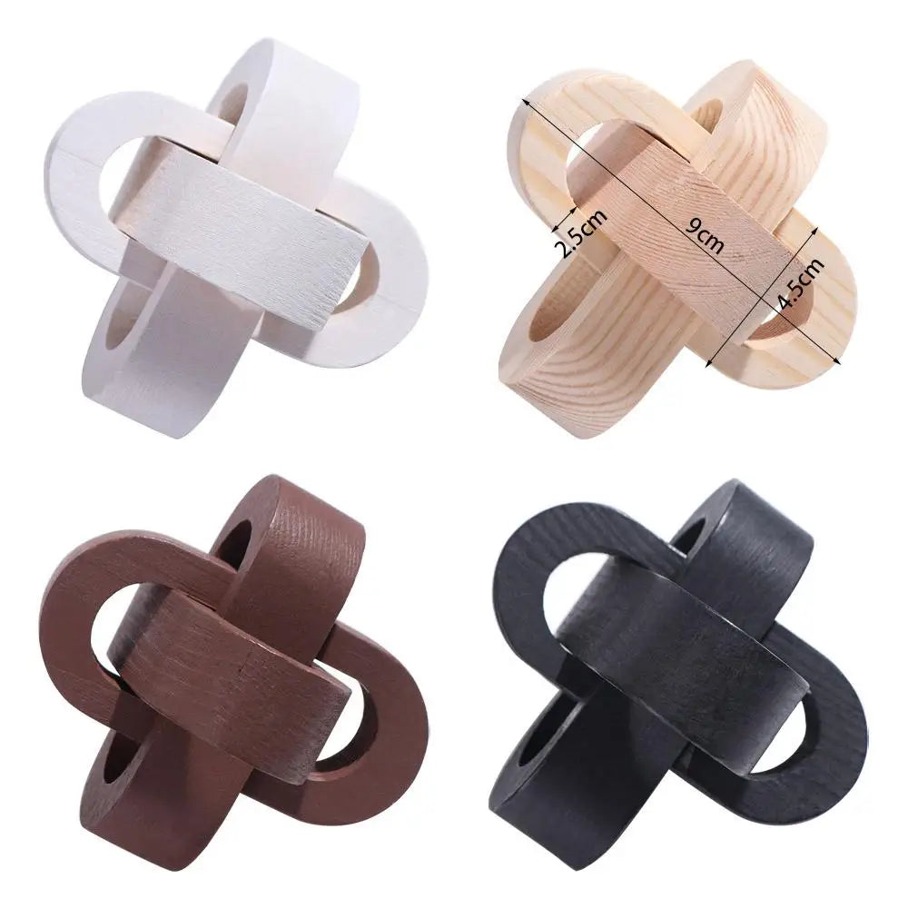 Decorative wooden knot ornaments in white, natural, brown, and black, featuring an interlocking geometric design.