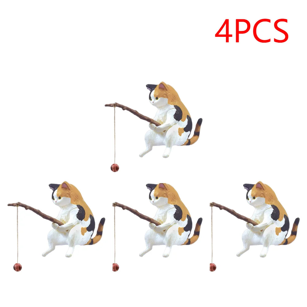 Four cute calico cat aquarium ornaments, each holding a small twig fishing rod with a tiny bobber.
