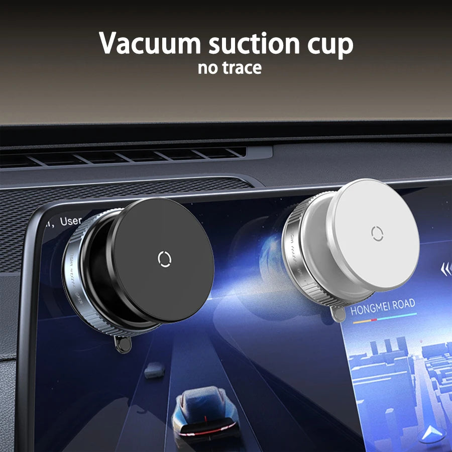 Black and silver round vacuum suction mounts attached to a car infotainment screen. Minimalist, sleek design.
