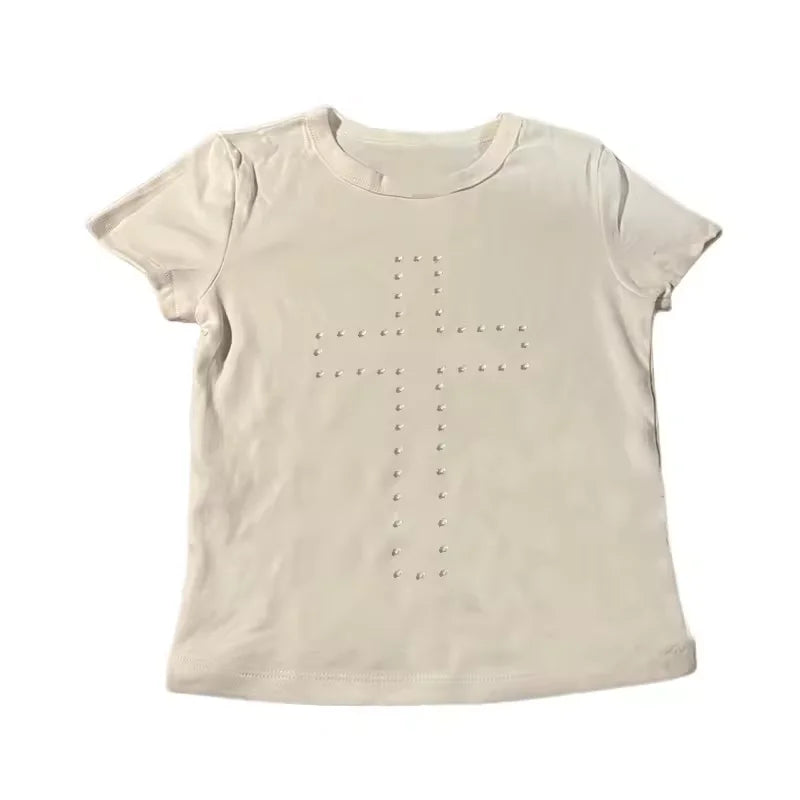 Cream short-sleeved crew neck t-shirt featuring a cross motif outlined in small silver studs.