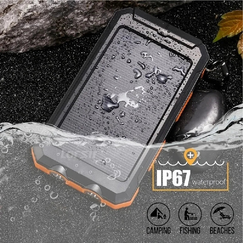 Rugged black and orange solar power bank with a waterproof IP67 rating, shown partially submerged in water.