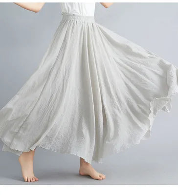 Flowing light grey pleated maxi skirt with an elasticated waistband, perfect for a breezy, elegant summer look.