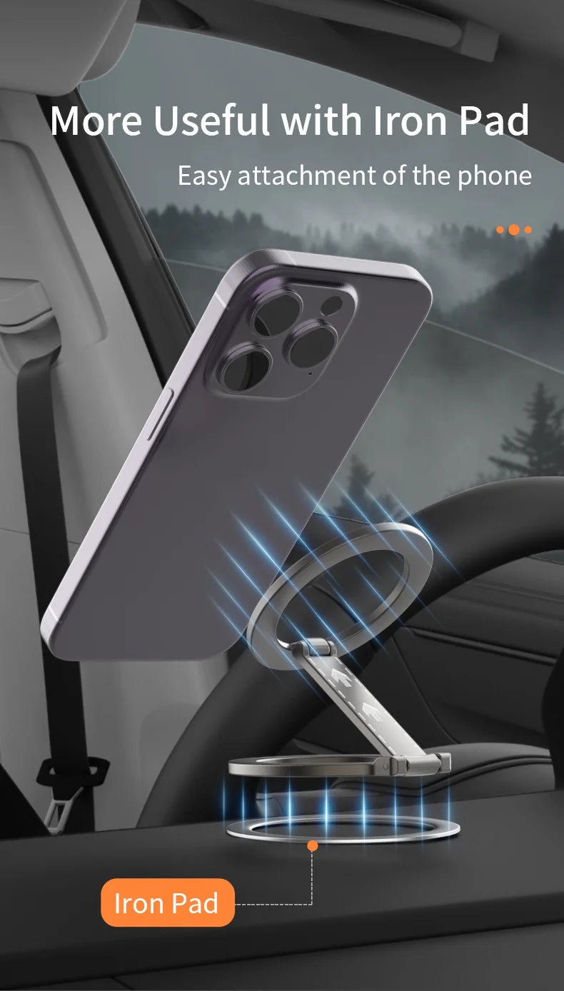 Silver ring-style magnetic car phone mount with a foldable stand, attached to a dashboard via a circular iron pad.
