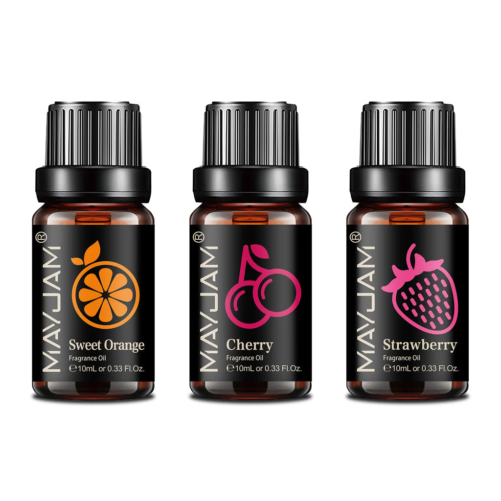 Three 10ml amber glass fragrance oil bottles with black caps, labelled Sweet Orange, Cherry, and Strawberry.