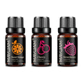 Three 10ml amber glass fragrance oil bottles with black caps, labelled Sweet Orange, Cherry, and Strawberry.