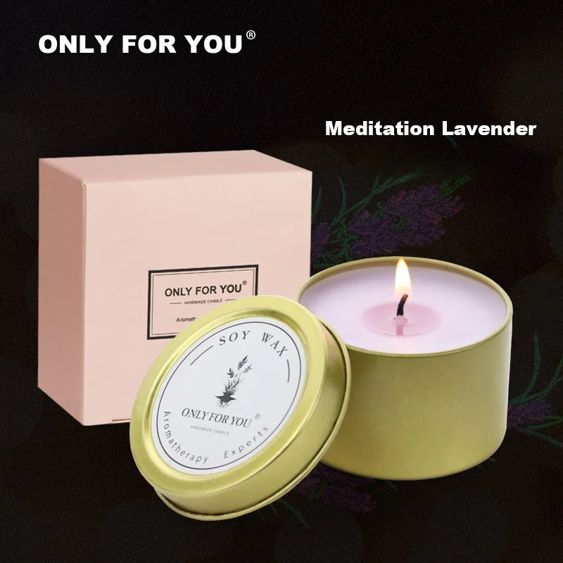 Lighted lavender scented soy wax candle in a gold tin with a matching pink gift box.