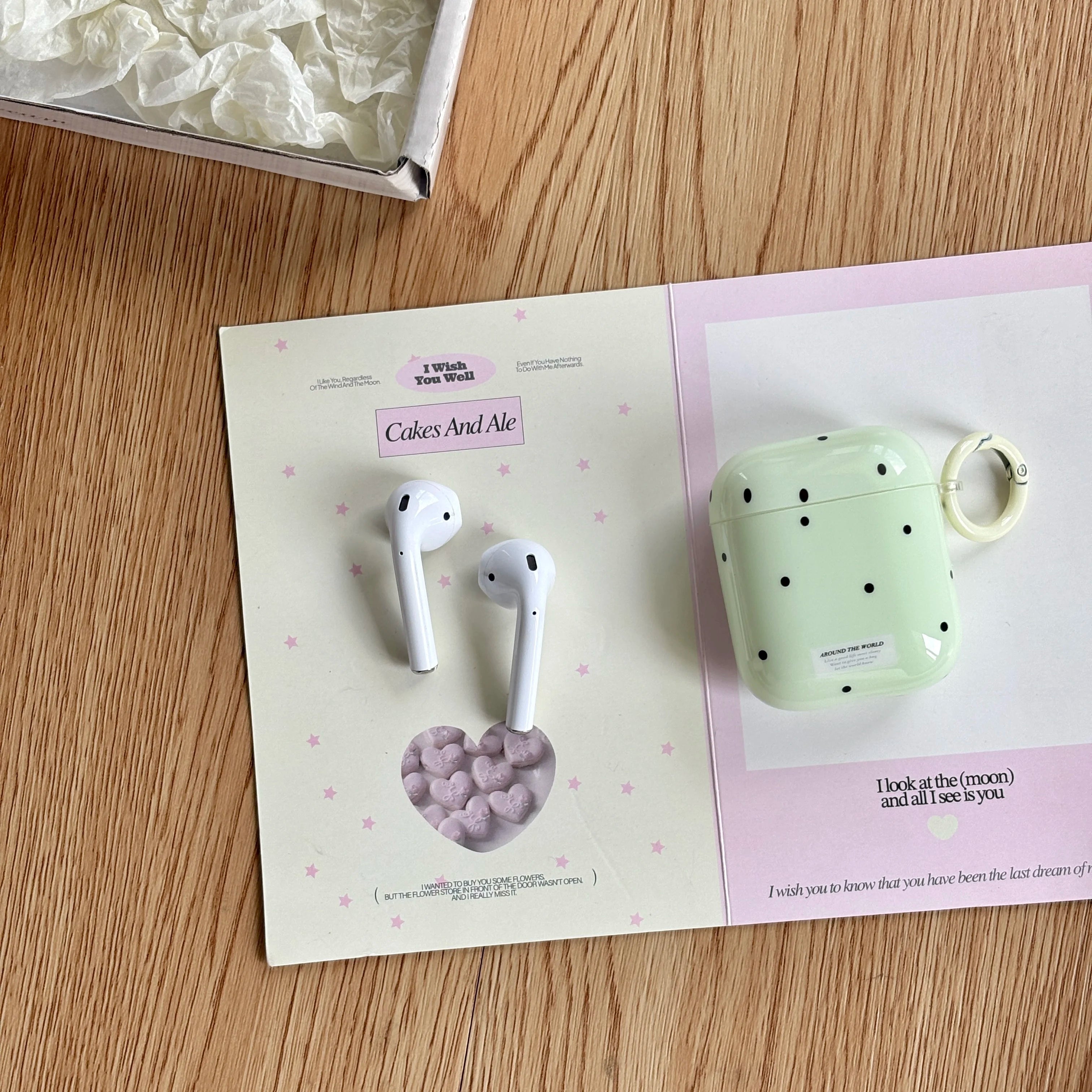 Sage green spotted hard shell AirPods case with ring, compatible with AirPods 1 & 2.