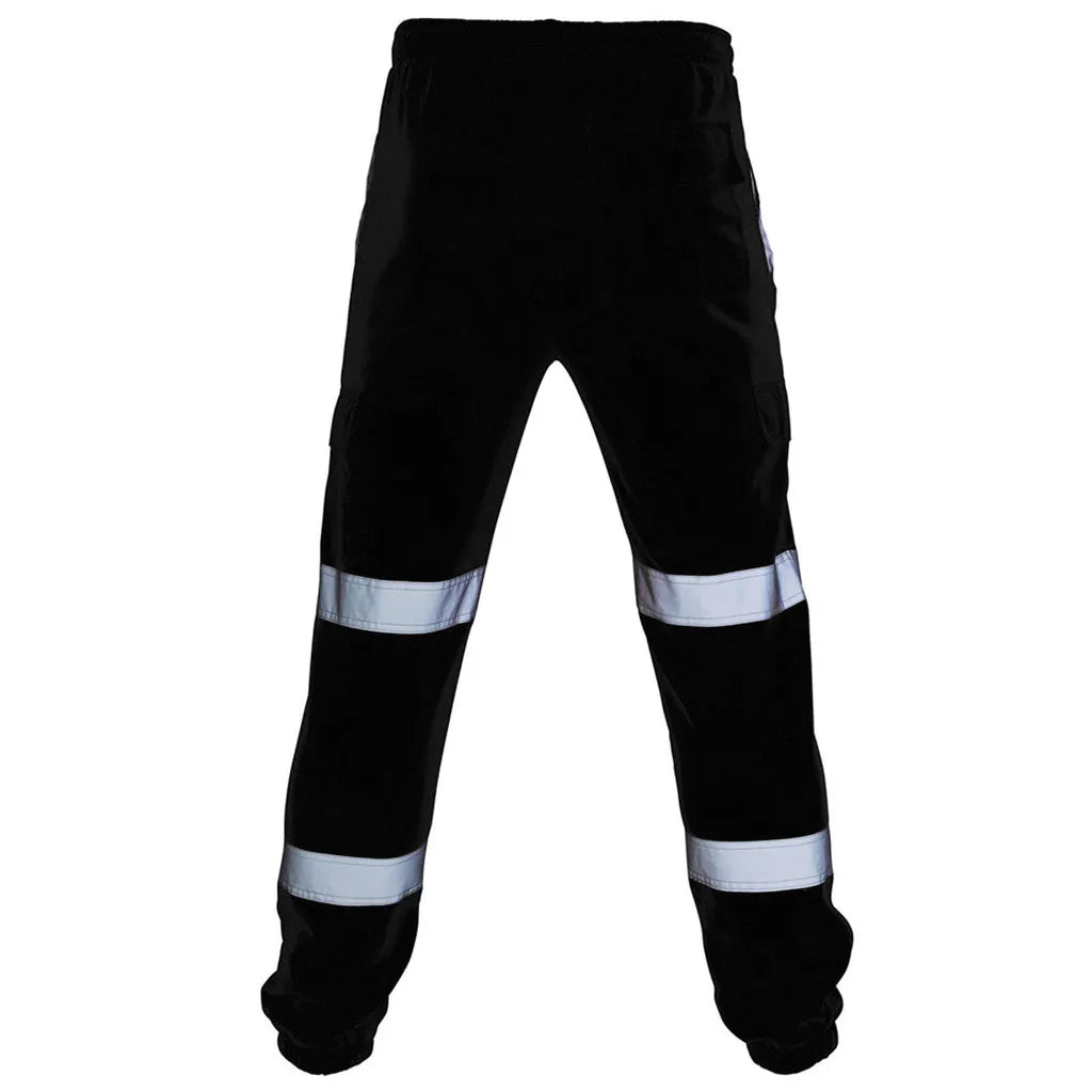 Black high-visibility work trousers with two horizontal silver reflective strips on each leg and an elasticated waist.