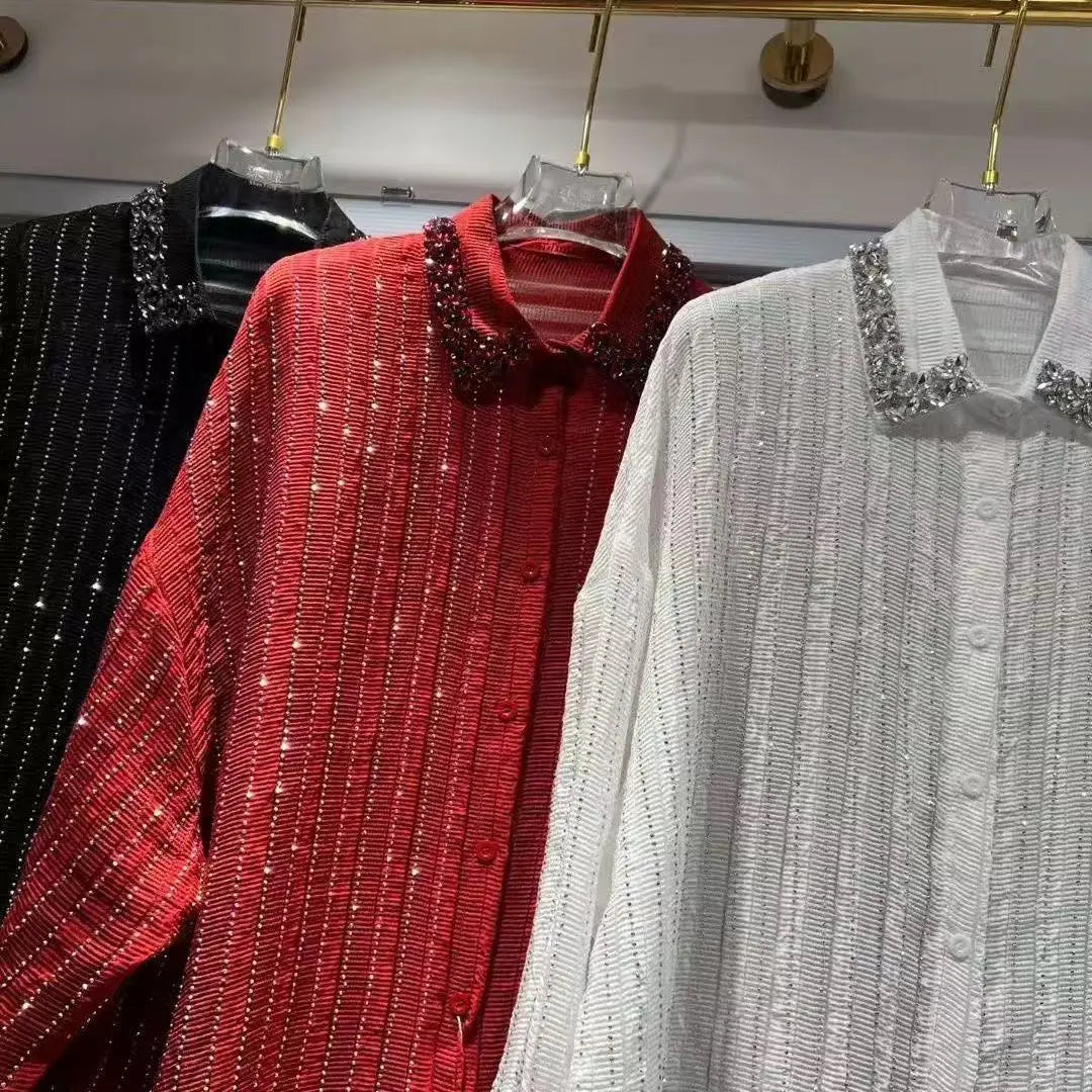 Three long-sleeve shirts in black, red, and white, with vertical shimmering stripes and embellished crystal collars.