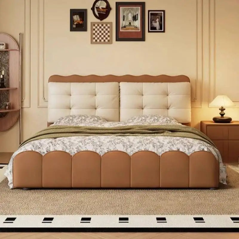 Modern platform bed with a cream tufted headboard, tan scalloped frame, and integrated storage in a stylish bedroom.