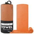 Orange microfibre towel next to its black mesh travel bag.