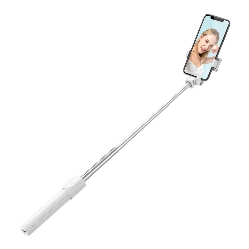 Extendable white selfie stick holding a smartphone displaying a photo of a woman, isolated on a white background.
