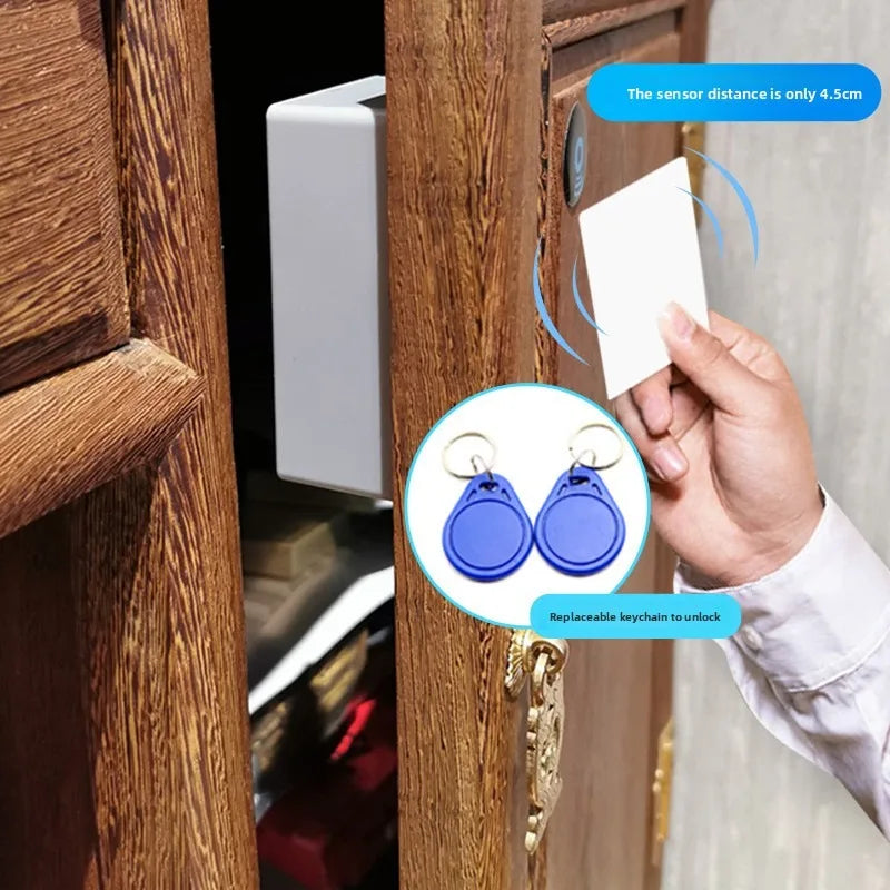 RFID cabinet lock set with white plastic sensor card and two blue plastic keychain fobs for hidden drawer access.