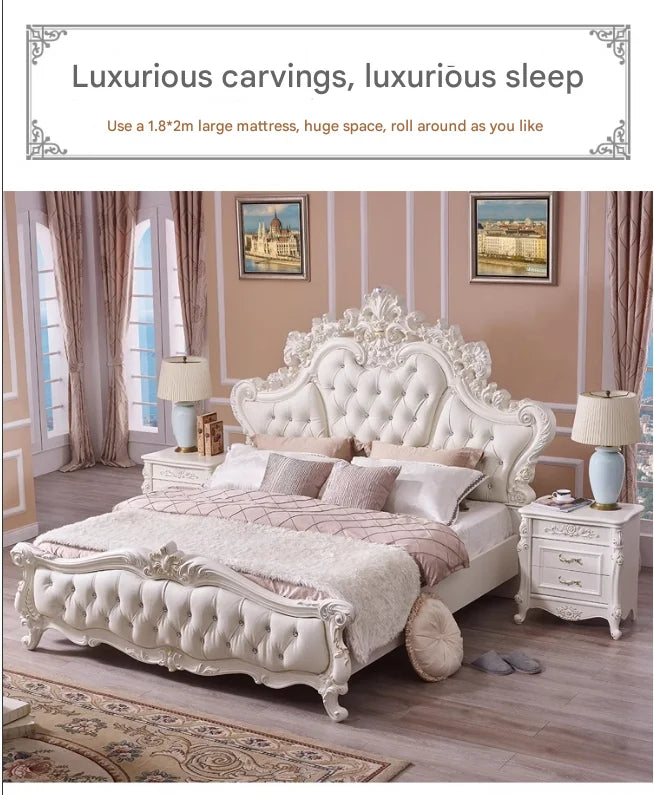 Luxury white king-size bed with an ornate carved frame, tufted headboard, and matching bedside tables.