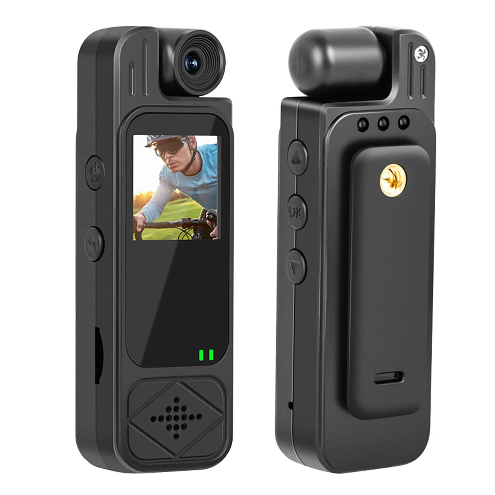 Black plastic body camera with a small LCD screen, front-facing lens, control buttons, and a rear belt clip.