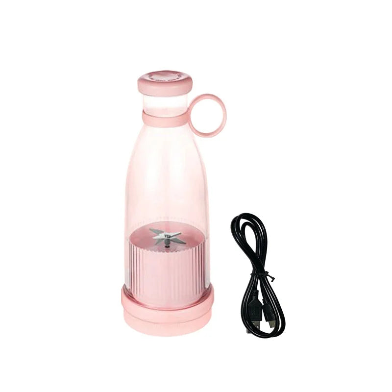 Portable light pink personal blender bottle with a carry ring and a black USB charging cable.