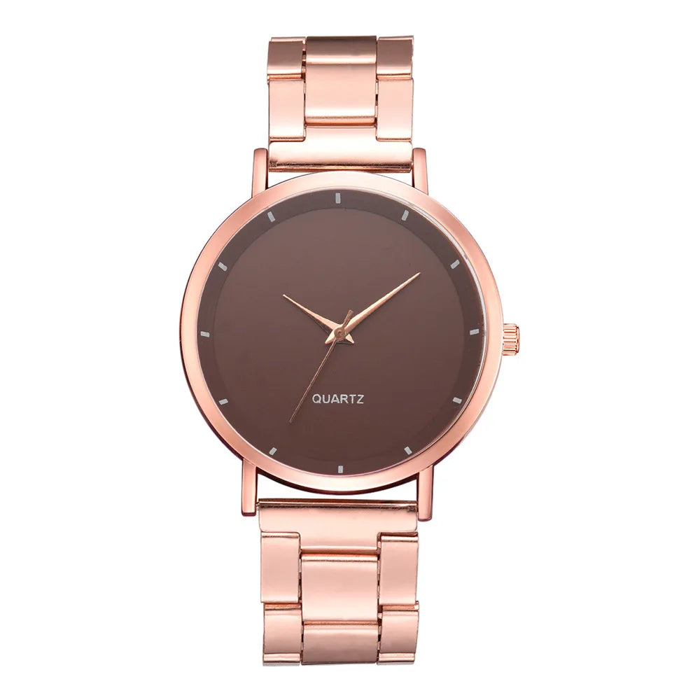 Elegant ladies' rose gold stainless steel watch with a minimalist round brown face and link bracelet strap.